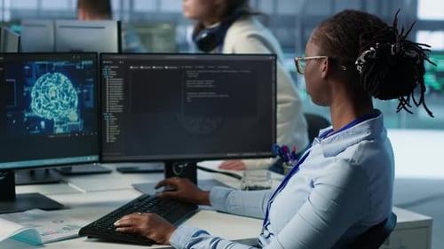 Woman Leaving Desk After Finishing Programming Tasks in AI Data Center