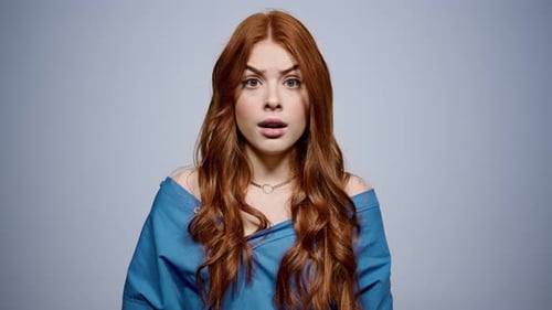 Surprised Woman Looking At Camera With Open Mouth