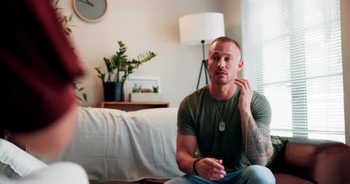 Man Talking on Couch During Therapy Session