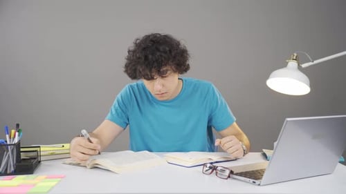 Male student studying.