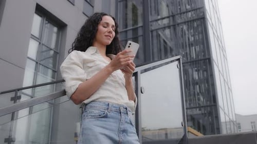 Bottom View Caucasian Hispanic 30s Woman in City Female Tourist Businesswoman with Phone Outdoor