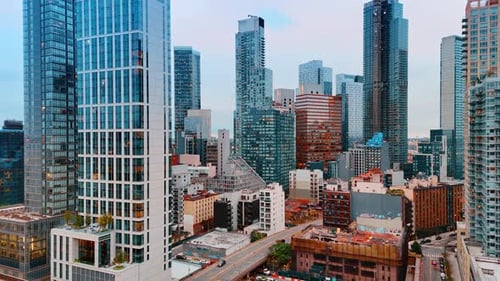 Diverse urban landscape of New York, USA. Drone footage rising along the high-rise buildings.