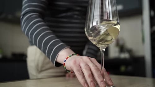 Pouring White Wine into a Glass and Drinking — Elegant Wine Enjoyment Moment