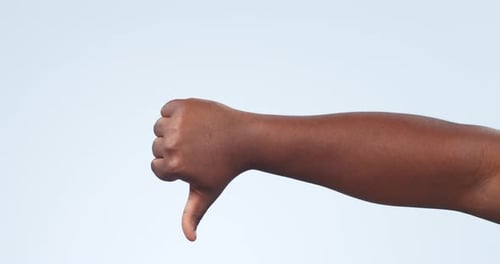 Hand, zoom and person with thumbs up in studio for feedback, success or review on blue background