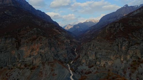 Aerial view the mountains are covered in trees and river in autumn season