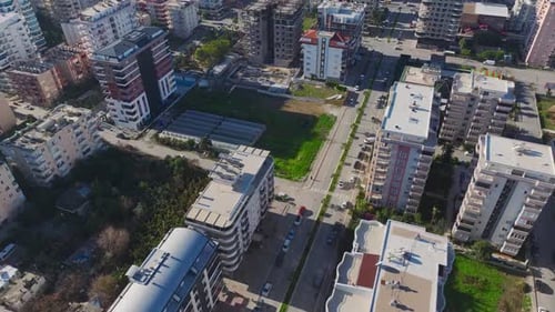 Aerial Video of a Busy City Intersection With Moving Cars Pedestrians and Skyscrapers in the