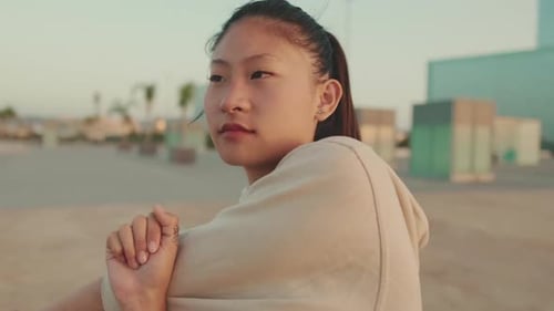 Young Adult Woman Stretching Arm