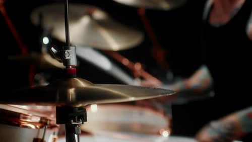 Playing Rock Music Closeup View of Drum Set and Drumsticks in Hands of Musician Details of Musical