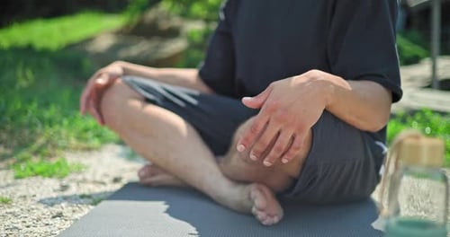 Hands Closeup Young African American Spirituality Man Meditating Yoga Asana Sitting in a Park