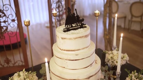 Elegant Wedding Cake with Flowers and Candles