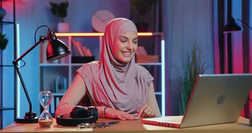 Woman On Video Call At Desk With Laptop