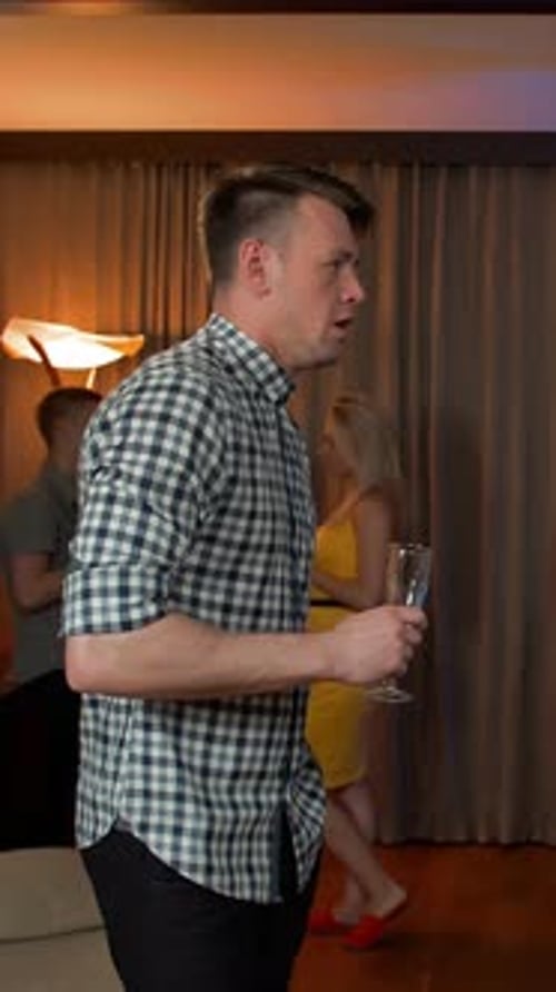 Adults Celebrating a Birthday at an Indoor Party