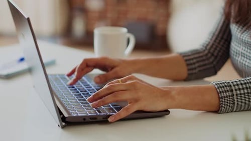 Teleworker Writing Emails on Laptop Sending Them to Business Partners