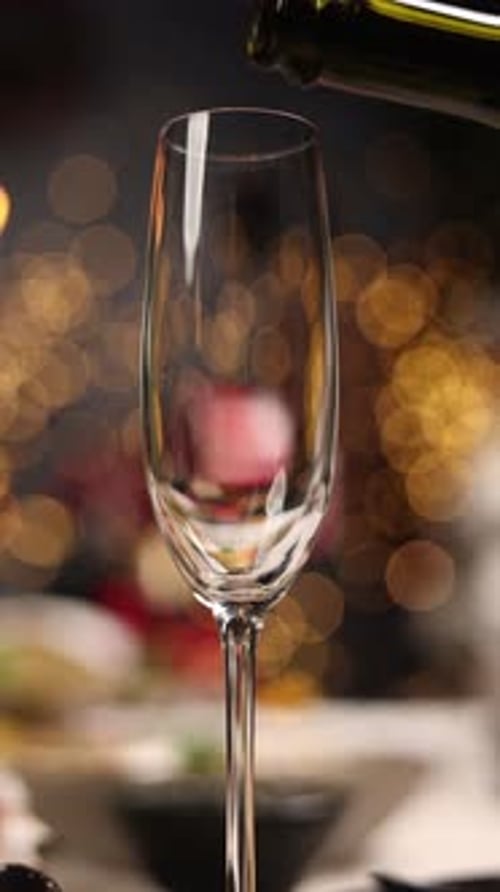 A bartender pours champagne. Close up