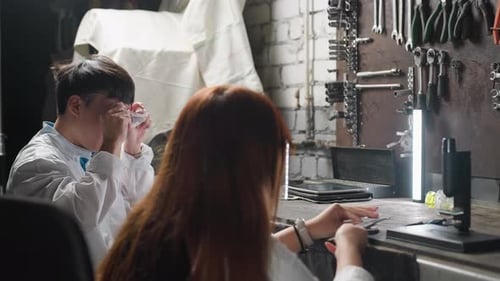 Lab Technicians Working on Automotive Components in Workshop