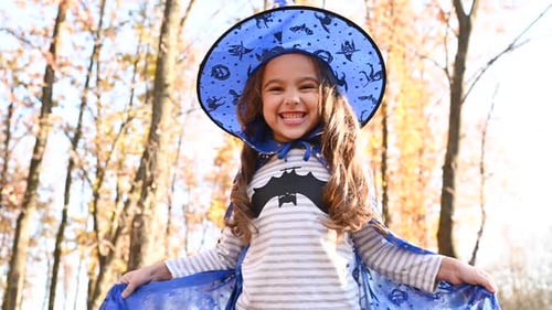 Girl in Witch Costume Celebrates Halloween