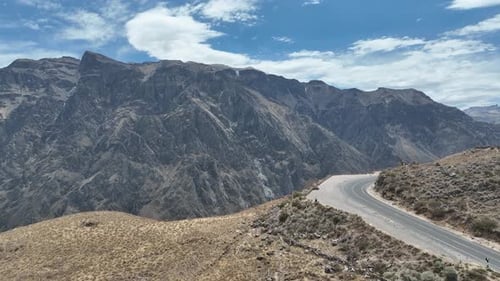 Aerial drone shot from the mountains in peru south america with a view over the canyon on a sunny su