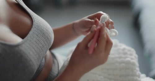 Woman Crocheting White Yarn Indoors Close Up