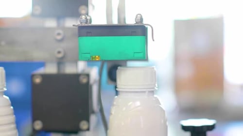 Technologie de capteurs de fabrication automatisée pour le remplissage des bouteilles et le contrôle qualité