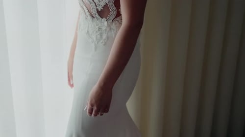 Woman in White Dress Standing near Window