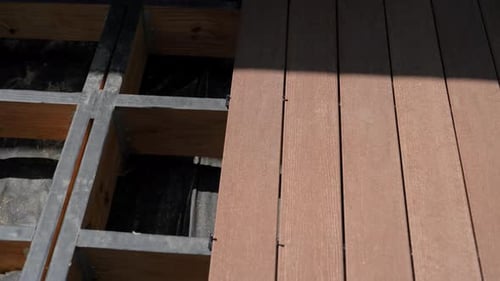 Brown Composite Decking Material Installed Over Wood Structure