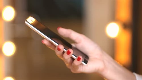 Woman using smartphone, modern technology, close up shot
