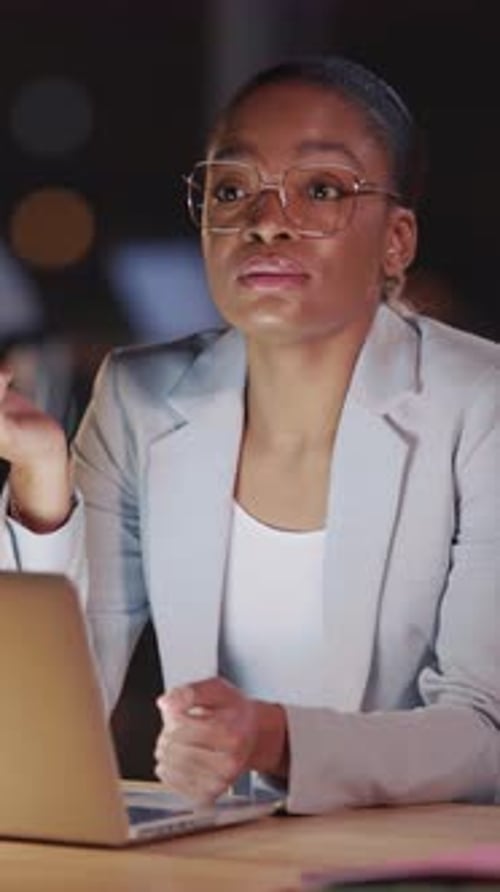 Professional Woman Working Late at Urban Office