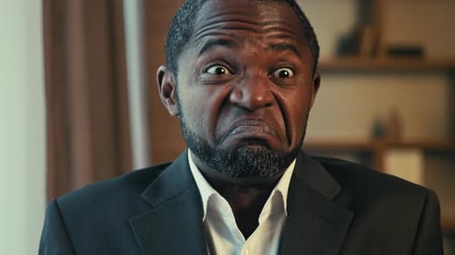 Man Expressing Shock with Facial Expressions