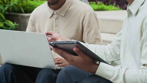 Freelancers Coworking with Digital Devices Outdoors