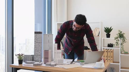 Indian Male Architect Designing Modern City Project in Office