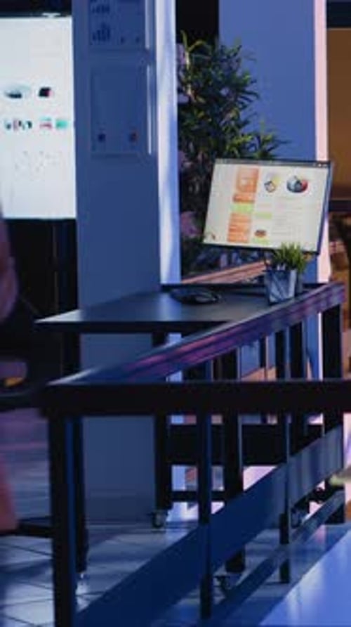 Vertical Video Entrepreneur Checking Financial Report on Computer