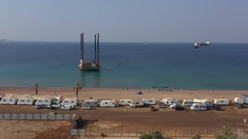 A jackup rig or a self-elevating unit mobile platform in an offshore area in front of Public HaDatiy