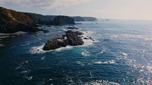 The turquoise waters of the atlantic ocean contrasting against the dramatic cliffs and coastline of