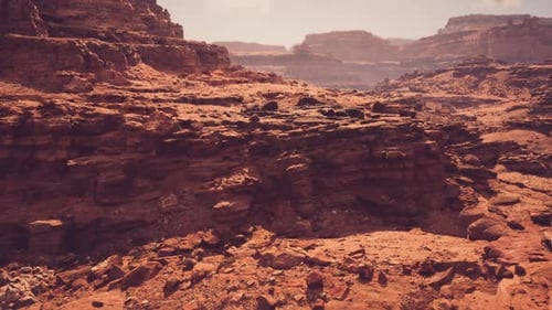 Wide Canyon Terrain Showcasing Strata and Weathered Cliffs for Study