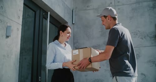 Postman Delivering Parcel Box for Recipient Businesswoman Signing POD on Tablet Computer