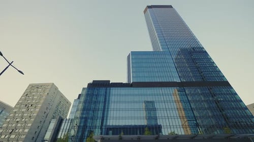 Low View of the Vast Glass Modern Office Building on the Business District Corporate Business High