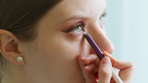 Makeup Artist Work in Her Beauty Studio Portrait of Woman Applying By Professional Make Up Master