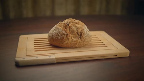 Rustic Bread on Wooden Table with Cutting Board