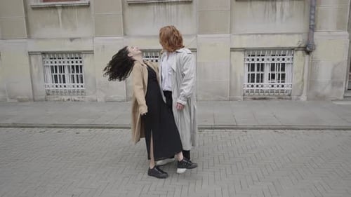 Couple Dancing on Urban Sidewalk