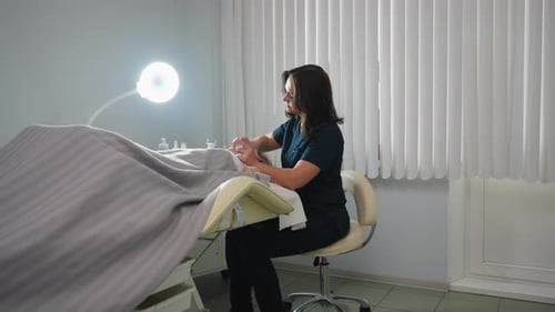 Therapist Attends Reclined Client In Spacious Spa Session