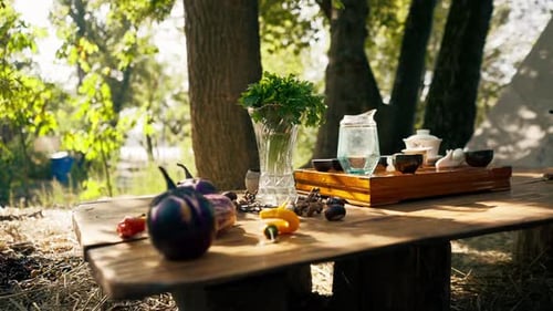 A wooden stand with bowls filled with water and cups of tea stands on table among greens vegetables