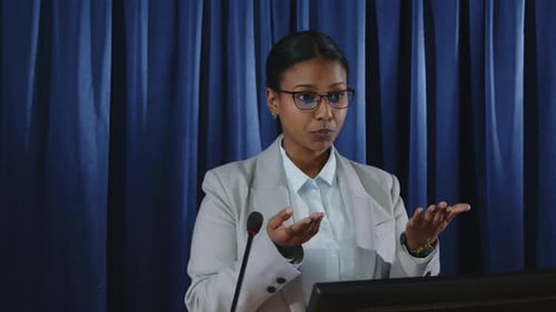 Young Adult Woman Presenting at Podium