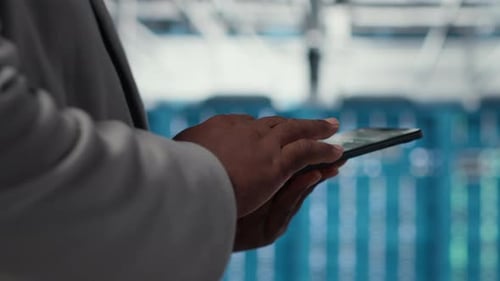 Close Up of Admin in Data Center Workplace Using Tablet