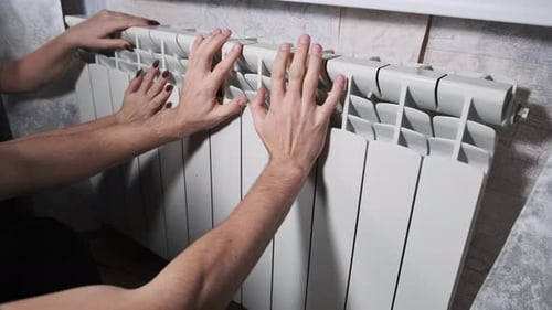 Cold Hands are Warmed By Heating Radiators Poor Heating System