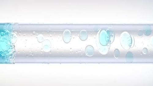 Foto macro de bolhas de ar transparente de tamanhos diferentes em água limpa subindo em um tubo de ensaio de vidro branco