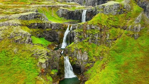Wispy Waterfalls Flowing Over Cliff Mountain River Falling Over Cliff Creating Many Waterfalls with