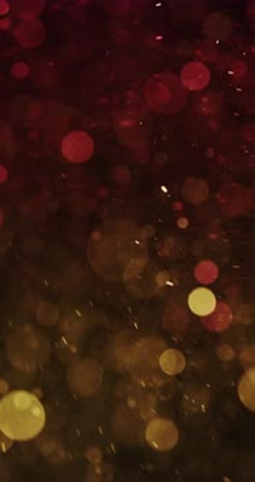Dynamic Red And Yellow Bokeh Particles In Motion