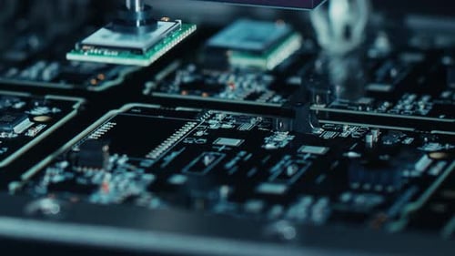 Close-up Macro Shot of Electronic Factory Machine at Work: Printed Circuit Board (PCB) Being Assemb