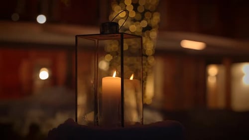 A Cozy Lantern Candle Creates a Serene Atmosphere with Gentle Bokeh Lighting at Night