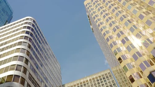 Time Lapse of Clouds Reflecting Into the Glass of a Large Office Building